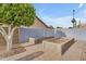Outdoor garden area with planted beds surrounded by beautiful stone pavers at 780 S Lagoon Dr, Gilbert, AZ 85233