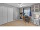 Bedroom with neutral walls, a desk, and closet space at 780 S Lagoon Dr, Gilbert, AZ 85233