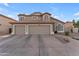 Attractive two-story home with a three-car garage and well-maintained desert landscaping at 780 S Lagoon Dr, Gilbert, AZ 85233