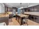 Well-appointed kitchen with granite countertops, stainless steel appliances, and dark wood cabinetry at 780 S Lagoon Dr, Gilbert, AZ 85233
