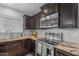 Modern kitchen featuring granite countertops, stainless steel appliances, and ample cabinet space, a culinary dream at 780 S Lagoon Dr, Gilbert, AZ 85233
