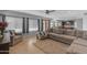 Comfortable living room with large windows, plush seating, and a cozy area rug at 780 S Lagoon Dr, Gilbert, AZ 85233