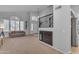 Bright living room with soaring ceilings, large windows, and a staircase, creating an inviting space at 780 S Lagoon Dr, Gilbert, AZ 85233