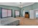 Spacious bedroom with plenty of natural light, large windows, and a comfortable king-size bed at 780 S Lagoon Dr, Gilbert, AZ 85233