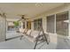 Relaxing outdoor space with a swing, ceiling fan, and views of the well-maintained backyard at 780 S Lagoon Dr, Gilbert, AZ 85233