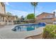 Beautiful backyard with a sparkling pool, lush landscaping, and serene outdoor living space at 780 S Lagoon Dr, Gilbert, AZ 85233