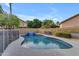 Refreshing pool with a relaxing waterfall feature, ideal for hot summer days at 780 S Lagoon Dr, Gilbert, AZ 85233
