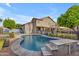 Inviting backyard with a sparkling pool and surrounding patio area, perfect for entertaining at 780 S Lagoon Dr, Gilbert, AZ 85233