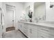 This bright bathroom has double sinks, granite countertop, and modern fixtures at 7902 E Via Linda --, Scottsdale, AZ 85258