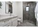 This well-lit bathroom features a marble vanity, glass-enclosed shower, and modern fixtures at 7902 E Via Linda --, Scottsdale, AZ 85258