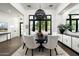 Elegant dining room featuring a round table, modern lighting, and stylish decor for intimate gatherings at 7902 E Via Linda --, Scottsdale, AZ 85258