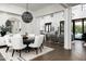 Open-concept dining area flowing into a living space, showcasing modern design and elegant furnishings at 7902 E Via Linda --, Scottsdale, AZ 85258