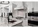 Gourmet kitchen features high-end appliances and custom tile backsplash at 7902 E Via Linda --, Scottsdale, AZ 85258