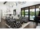 Bright and open living space connecting to a kitchen, featuring modern decor, and seamless indoor-outdoor living at 7902 E Via Linda --, Scottsdale, AZ 85258