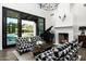 Inviting living room with a fireplace, comfortable seating, and a view of the pool at 7902 E Via Linda --, Scottsdale, AZ 85258