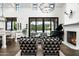 Stylish living room with high ceilings, a fireplace, a piano, and seamless indoor-outdoor flow at 7902 E Via Linda --, Scottsdale, AZ 85258