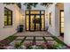 Charming outdoor patio with stone pavers, lush landscaping, and stylish seating, perfect for relaxing at 7902 E Via Linda --, Scottsdale, AZ 85258