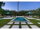 This beautiful backyard features a sparkling pool, lush landscaping, and inviting lounge area at 7902 E Via Linda --, Scottsdale, AZ 85258