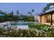 This home features a sparkling pool, lush landscaping, and an outdoor living space at 7902 E Via Linda --, Scottsdale, AZ 85258