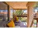 Relaxing balcony space with cushioned chairs, overlooking beautiful landscaping and neighborhood views at 8700 E Mountain View Rd # 2011, Scottsdale, AZ 85258