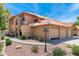 Charming two-story home with a well-manicured yard, featuring a tile roof and inviting curb appeal at 8700 E Mountain View Rd # 2011, Scottsdale, AZ 85258