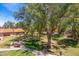 Lush landscaping and mature trees surround charming homes with red tile roofs, creating a serene atmosphere at 8700 E Mountain View Rd # 2011, Scottsdale, AZ 85258