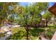 Beautiful exterior view of a home with a manicured lawn and mature trees providing ample shade at 8700 E Mountain View Rd # 2011, Scottsdale, AZ 85258