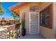 Welcoming entryway with a security door, complemented by a potted plant and stylish exterior accents at 8700 E Mountain View Rd # 2011, Scottsdale, AZ 85258