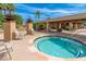 Luxurious hot tub with nearby lounge area and covered patio, offering a perfect spot for relaxation and entertainment at 8700 E Mountain View Rd # 2011, Scottsdale, AZ 85258