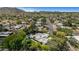 Neighborhood aerial shot showcases lush landscaping, mature trees, and easy access to nearby amenities at 9829 N 49Th Pl, Paradise Valley, AZ 85253