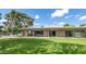 Large backyard with green lawn, patio, and modern home exterior, perfect for outdoor living at 9829 N 49Th Pl, Paradise Valley, AZ 85253