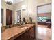 Stylish bathroom with a warm-toned countertop and modern fixtures at 9829 N 49Th Pl, Paradise Valley, AZ 85253