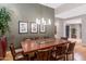 Elegant dining room showcasing a modern chandelier, sleek hardwood floors, and a spacious layout at 9829 N 49Th Pl, Paradise Valley, AZ 85253