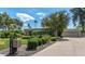Stylish home exterior boasts desert landscaping, a circular driveway, and modern design elements at 9829 N 49Th Pl, Paradise Valley, AZ 85253