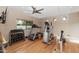 Home gym with treadmills, weights, and a ceiling fan at 9829 N 49Th Pl, Paradise Valley, AZ 85253