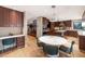 Eat-in kitchen featuring dark cabinets, stainless appliances, and a bright breakfast nook at 9829 N 49Th Pl, Paradise Valley, AZ 85253