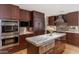Well-equipped kitchen featuring stainless appliances, granite counters, and a functional island at 9829 N 49Th Pl, Paradise Valley, AZ 85253