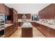 Spacious kitchen featuring granite countertops, stainless appliances, and ample cabinet space at 9829 N 49Th Pl, Paradise Valley, AZ 85253