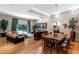 Open-concept living area featuring hardwood floors, ample seating, and a seamless flow to dining spaces at 9829 N 49Th Pl, Paradise Valley, AZ 85253