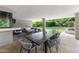 Covered patio with large dining table, seating area, and outdoor view at 9829 N 49Th Pl, Paradise Valley, AZ 85253
