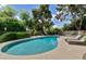 Inviting swimming pool with lush landscaping and lounge chairs at 9829 N 49Th Pl, Paradise Valley, AZ 85253