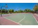 Outdoor basketball court with vibrant lines, mature trees, and ample space for recreational sports at 10234 E Lomita Ave, Mesa, AZ 85209