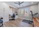 Office with built-in desk, cabinets, shelves, ceiling fan and wood look floors at 10234 E Lomita Ave, Mesa, AZ 85209