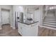 Bright kitchen featuring stainless steel appliances and a granite island at 10234 E Lomita Ave, Mesa, AZ 85209