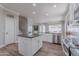 Bright, modern kitchen featuring stainless steel appliances and a view into a living area at 10234 E Lomita Ave, Mesa, AZ 85209