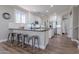 Stylish kitchen with granite countertops, modern appliances and bar stool seating at 10234 E Lomita Ave, Mesa, AZ 85209