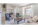 Inviting living room showcasing a comfortable sofa, chairs, staircase and dining area in the background at 10234 E Lomita Ave, Mesa, AZ 85209