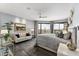 Large bedroom showcasing city views, a comfy seating area, and a king-size bed at 1040 E Osborn Rd # 1103, Phoenix, AZ 85014