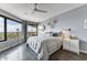 Spacious bedroom features large windows with city views, a telescope, and a comfortable king-sized bed at 1040 E Osborn Rd # 1103, Phoenix, AZ 85014