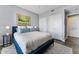 Cozy bedroom with a plush bed, neutral color scheme, and stylish decor create a relaxing ambiance at 1040 E Osborn Rd # 1103, Phoenix, AZ 85014